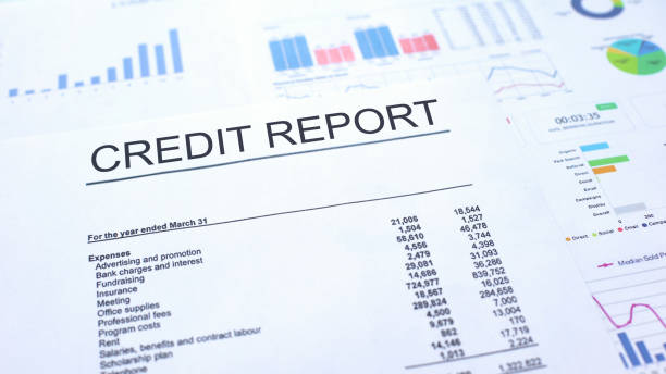 Credit report lying on table, graphs charts and diagrams, official document Credit report lying on table, graphs charts and diagrams, official document
