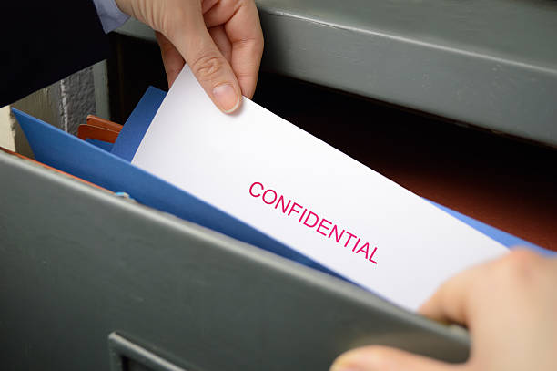 spy stealing confidential files in an office spy stealing confidential files in an office