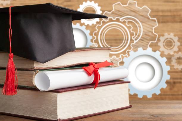 Graduation hat and stacks of books Graduation hat and stacks of books